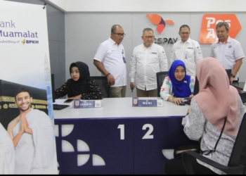 PosIND dan Bank Muamalat Luncurkan Layanan Tabungan Haji di Kantor Pos